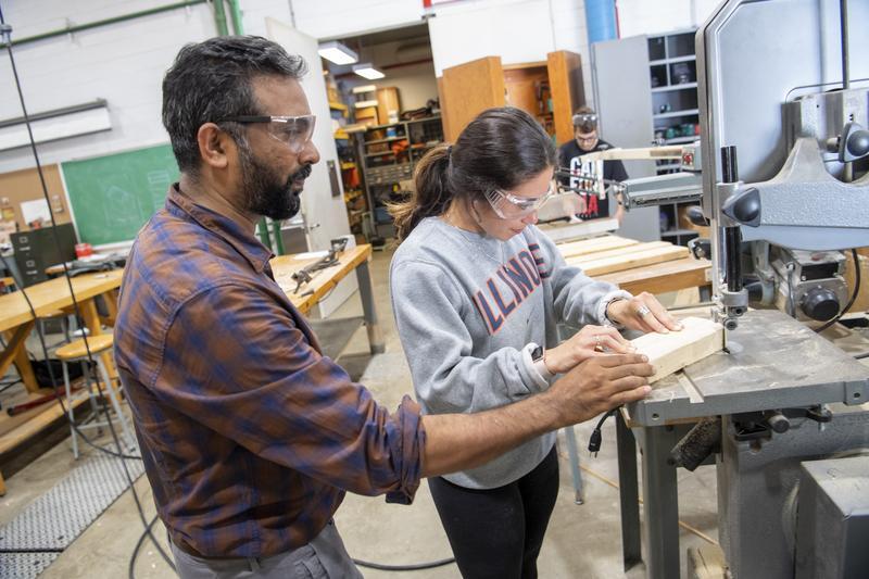 Student learning how to use a table saw.