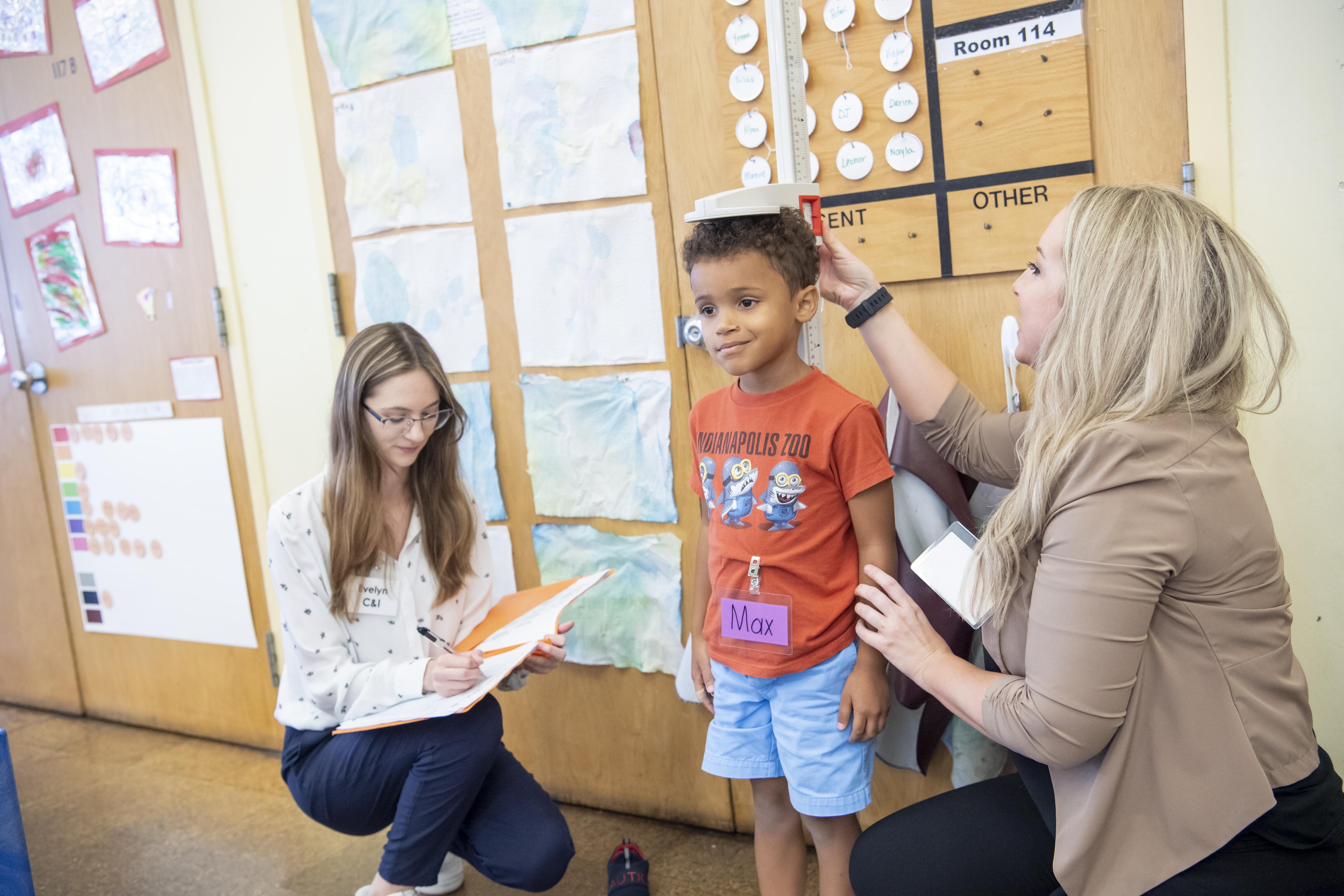Students working with children in the child development lab.