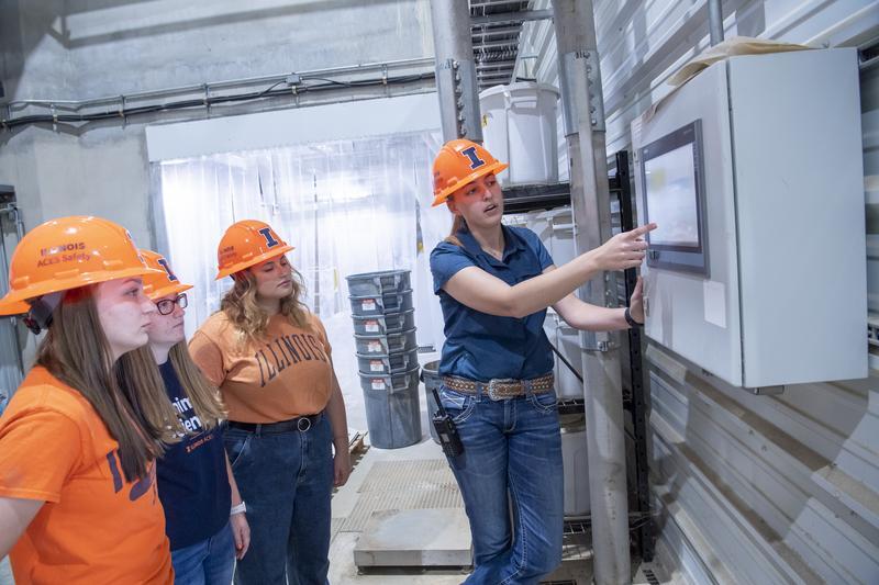 Student in hard hats at Food Technology Center.