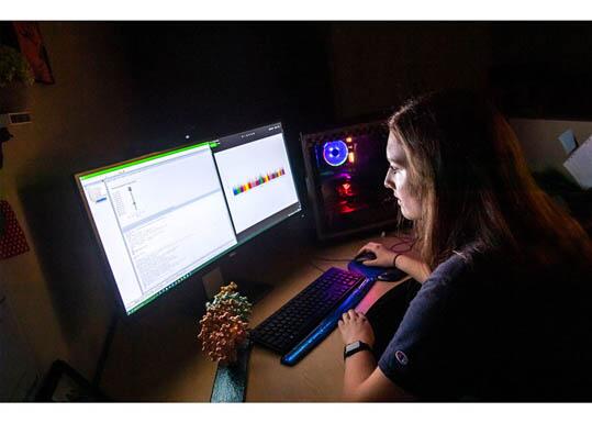 Student working on data on a computer